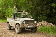 В экспедиционном джипе.